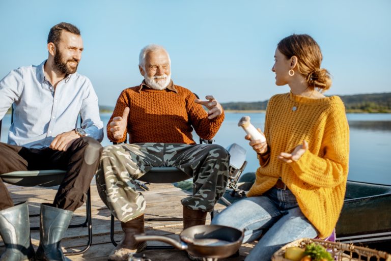 Grandfather with son and daughter on the picnic