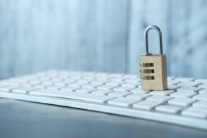 internet safety concept with padlocked on computer keyboard