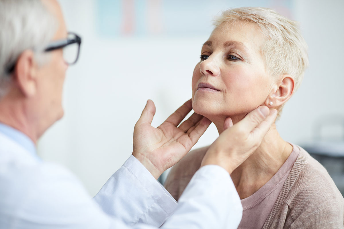 examining-patients-thyroid