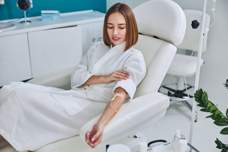 happy-cheerful-young-lady-resting-at-the-intraveno